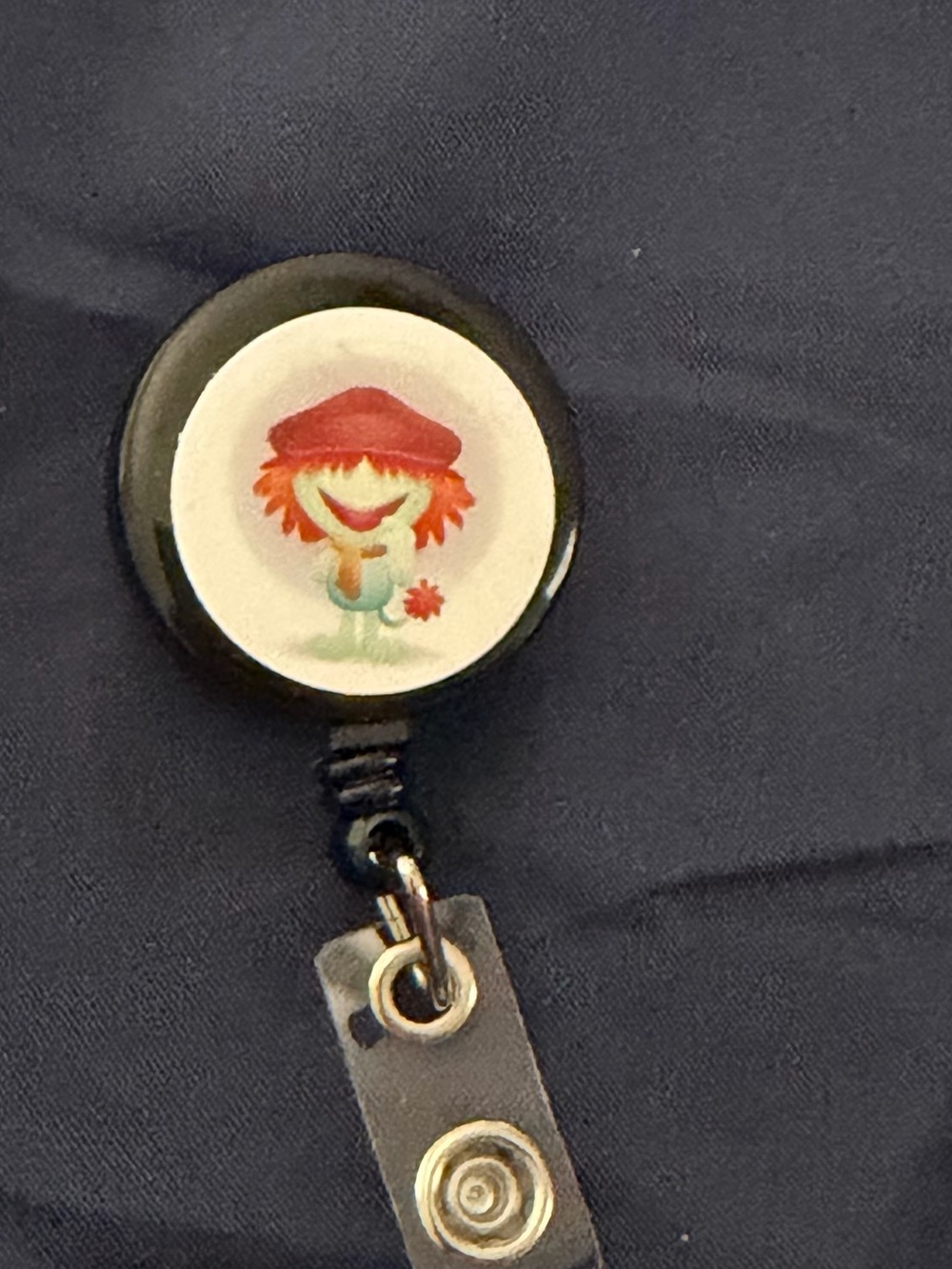 Black Retractable Badge Reel with Red Cartoon Character